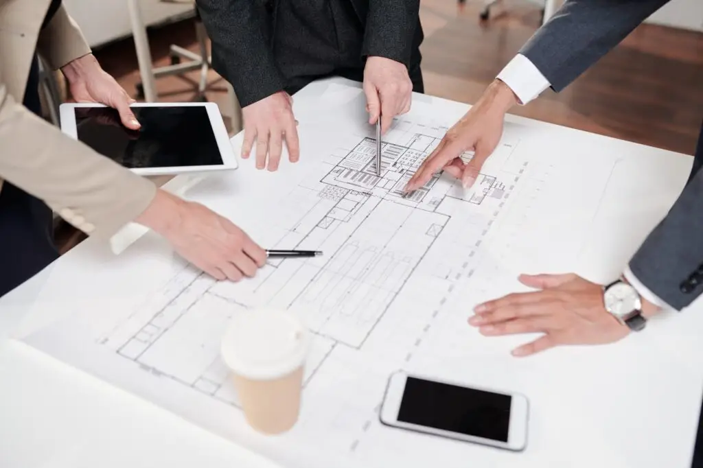 team of business people discussing construction plans
